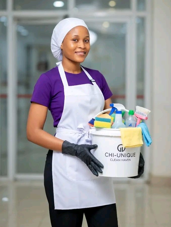 Chi-Unique Clean Haven professional cleaner holding a bucket of cleaning supplies in Lagos
